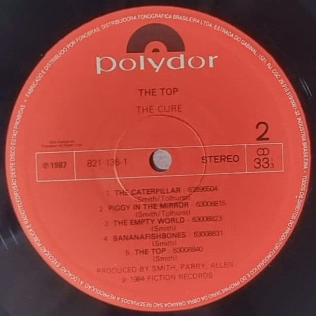 Etiqueta central de THE CURE — THE TOP