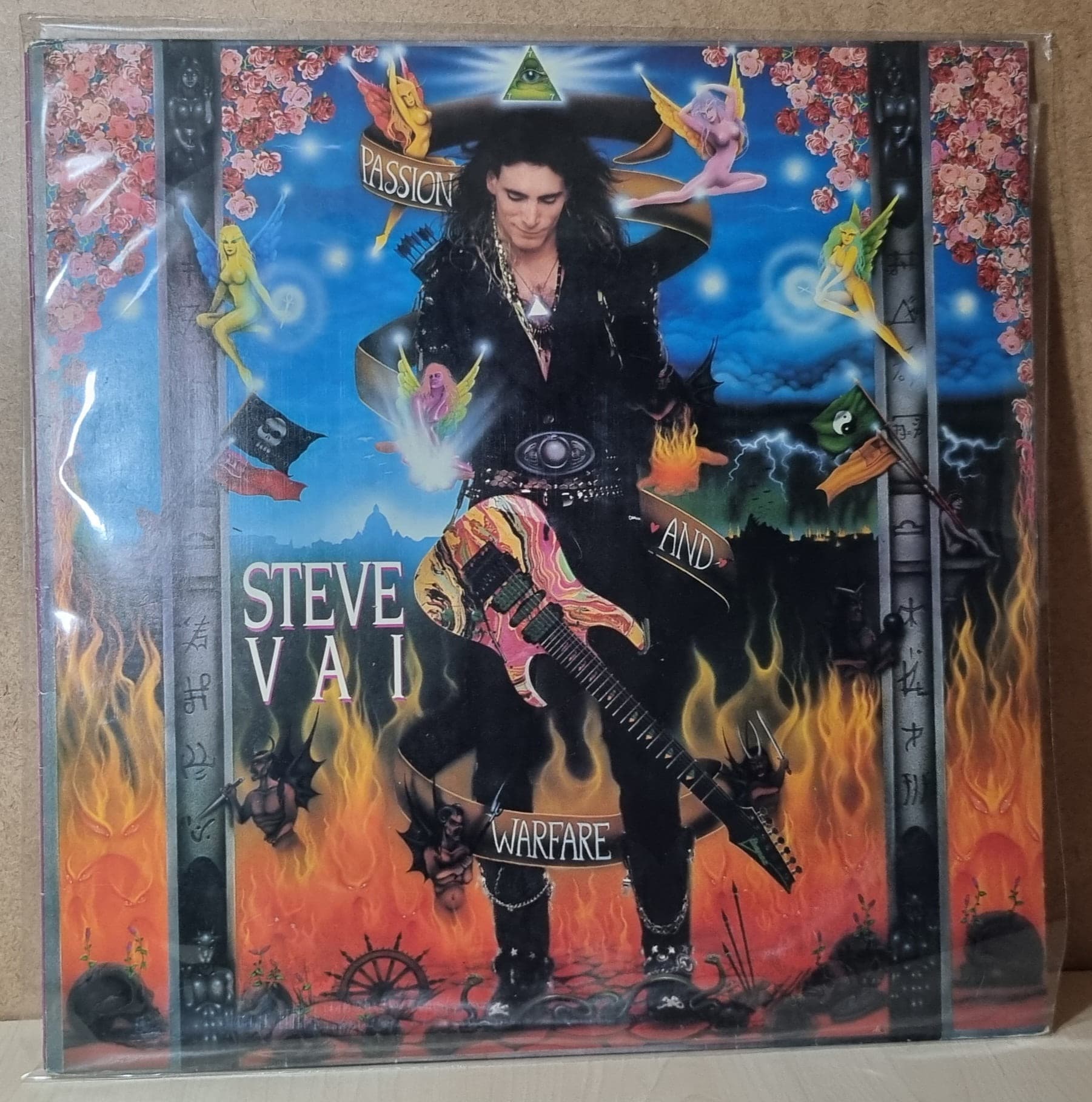 Etiqueta central de Steve Vai — Passion And Warfare